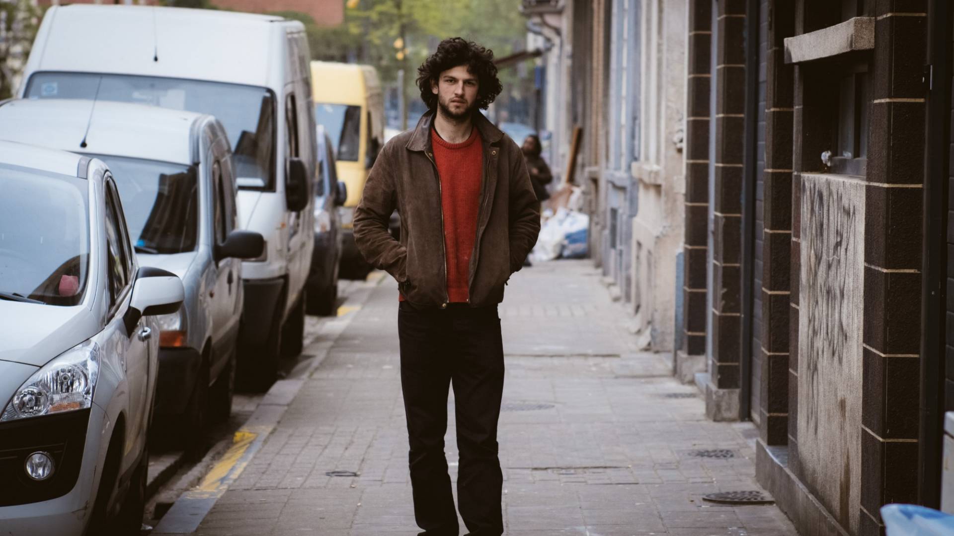 Andriu Deplazes strolls through the streets of Brussels, his hands in his jacket pockets.